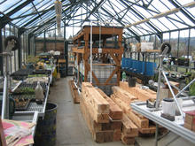 Blue barrels store collected rainwater for irrigation - Photo Credit: Opsis Architecture